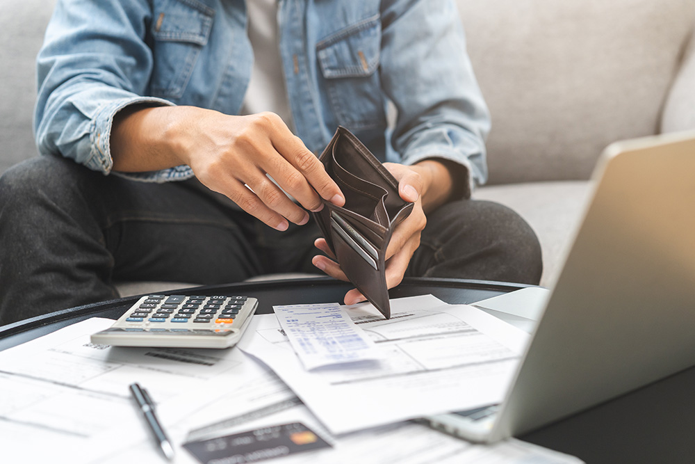 young man examining finances